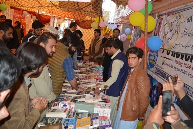 Readers at a book fair stall