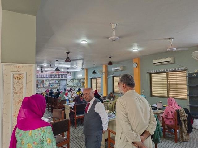 Guests tour the Female Digital Library