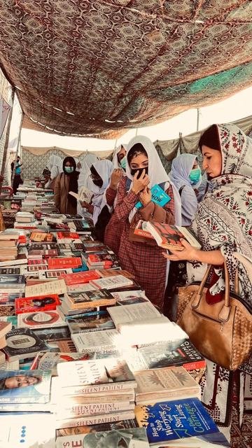 Women browse a book fair
